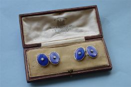 An attractive pair of 18ct and diamond blue enamelled cufflinks in fitted box. Est. £300 - £400.