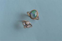 Two 9ct opal set rings. Est. £30 - £40.