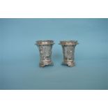 A pair of good Continental vases heavily decorated with figures and scrolls on bracket feet. Approx.