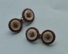 A pair of mid Victorian ruby, diamond and MOP circular cufflinks. Est. £300 - £350.