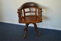 A good Edwardian swivel chair on pedestal base with leather back. Est. £250 - £300.