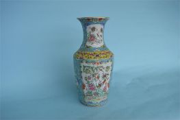 A late 19th Century Chinese famille rose baluster shaped vase decorated with flowers and birds.