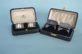 A boxed pair of bright cut napkin rings. Birmingham. By HT. Together with a pair of heavy Art Deco