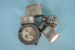 Three silver napkin rings together with thimbles and stopper etc. Various dates and makers. Est. £30