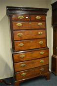 A mahogany eight drawer Georgian style chest on chest on bracket feet with dental frieze. Est. £