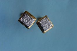 A pair of heavy 18ct Art Deco cufflinks each set with twenty diamonds. Est. £400 - £500.