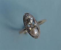 An Antique diamond and pearl two stone Art Deco style cluster ring in 18ct mount. Est. £650 - £700.