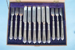 A set of six plus six Albany pattern fruit eaters with silver blades in fitted box. Sheffield