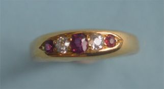 An attractive ruby and diamond five stone half hoop ring in 18ct mount. Est. £70 - £80.