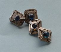 A pair of heavy platinum sapphire cufflinks with floral decoration. Approx. 14 grams. Est. £500 - £