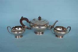 A circular Art Deco style baluster three piece tea service. Birmingham 1920. Approx 900 grams.