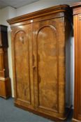 An attractive burr walnut wardrobe with fitted interior on pedestal base. Est. £280 - £320.