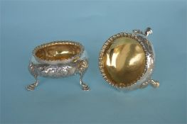 A pair of good quality embossed salts with hoof feet and gadroon rim. London 1855. By H&H. Approx.