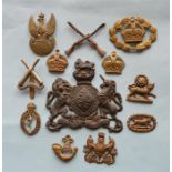 12 pieces to include: Various pieces all with broken lugs and Exeter Volunteer Regiment Cap badge.
