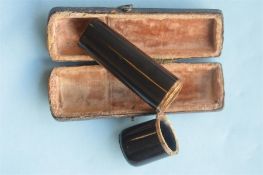 A gold mounted and onyx etui in Morocco case. Est. £150 - £200.