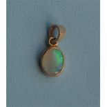 A small opal drop pendant with loop top. Est. £20 - £30.