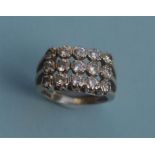 A good quality diamond 15 stone three row ring in white gold claw mount. Est. £250 - £300.