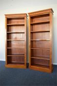 A good pair of satinwood bookcases on pedestal base. Approx. 190 cms high x 76 cms across each.