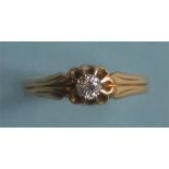 An 18ct diamond single stone gypsy set ring in claw mount. Est. £40 - £50.