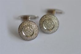 A good pair of diamond cufflinks in white gold. Est. £400 - £500.