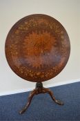 A good marquetry tripod table decorated with flowers and leaves on matching pedestal base. Approx.