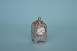 A good quality Victorian aesthetic miniature carriage clock with white enamel dial on bracket feet