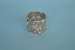 A good quality stylish napkin ring heavily embossed with flowers and leaves. Est. £45 - £50.
