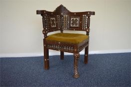 An Islamic carved and MOP inlaid chair with ball decoration. Est. £200 - £250.