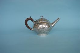 A stylish Continental bullet shaped teapot decorated with scrolls and leaves. Approx. 650 grams.