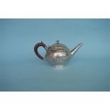 A stylish Continental bullet shaped teapot decorated with scrolls and leaves. Approx. 650 grams.