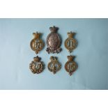 Six various Victorian style Shako badges. Est. £50 - £60.