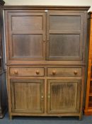 A good limed oak two piece kitchen cupboard with panel doors. Est. £550 - £600.
