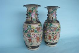 A good pair of Chinese late 19th Century famille rose crackle ware vases, decorated with figures.