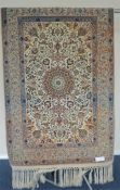 A modern Indian rug with Isfahan and circular medallion. Approx. 165 cms x 109 cms. Est. £50 - £90.