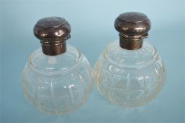 A pair of cut glass hinged top scent bottles. Birmingham. By L&S. Est. £60 - £80.