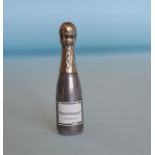 A rare and unusual miniature scent in the form of a champagne bottle with gilt lid and enamelled