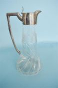 A mounted claret jug with reeded thumb piece and hinged top. Chester. By W&H. Est. £120 - £150.