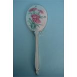 An attractive hand mirror enamelled with pink carnations. Birmingham 1950. By Aide Bros. Est. £120 -