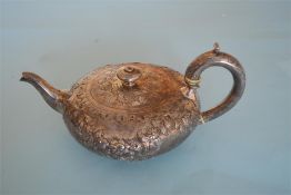 A chased and embossed teapot decorated with flowers and scrolls. London 1837. By JA&JA. Approx.