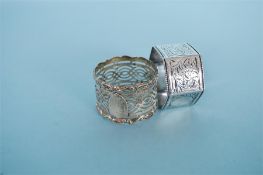 Two odd engraved napkin rings. Approx. 40 grams. Est. £30 - £40.
