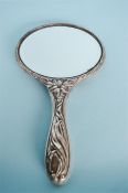 A stylish Art Nouveau hand mirror. Chester. By J&R. Est. £40 - £50.
