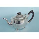 A large heavy teapot with reeded rim and canted corners on four ball feet. London 1922. Approx.