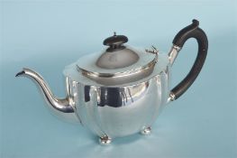 A large heavy teapot with reeded rim and canted corners on four ball feet. London 1922. Approx.
