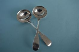 A pair of George III fiddle pattern crested sauce ladles. By William, Eley-Fearne and Chawner.