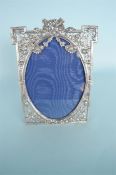 A good Continental ornate picture frame decorated with flowers and swags. Approx. 23 cms high.