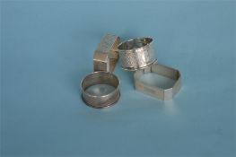 A heavy pair of engine turned Art Deco napkin rings. Birmingham. By W&H, together with two others.
