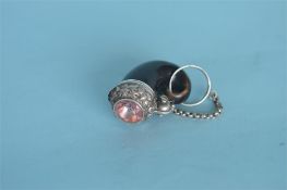 An unusual miniature Scottish snuff mull with hinged top enclosing silver gilt vinaigrette. Est. £