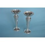 An attractive pair of vases with crimped rim and floral decoration on tapering supports. Approx.