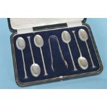 A heavy set of six nail top teaspoons and matching tongs in fitted box. Sheffield. By CB&S.