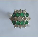 A good quality emerald and diamond five row 19 stone cluster ring in 18ct white gold. Est. £500 - £